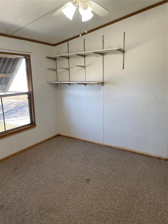 369 Private Road, Unit 4521 Wolfe City, TX 75496 - Photo 11 of 23 an empty room with windows and fan