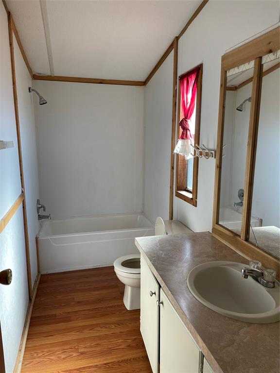 369 Private Road, Unit 4521 Wolfe City, TX 75496 - Photo 12 of 23 a bathroom with a sink a toilet and a bathtub