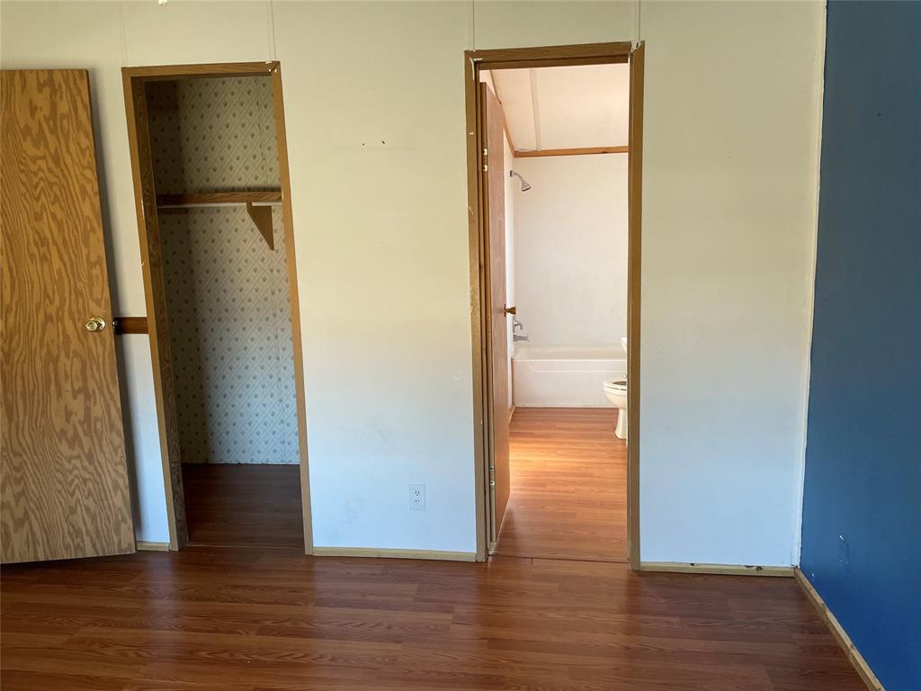 369 Private Road, Unit 4521 Wolfe City, TX 75496 - Photo 13 of 23 a view of empty room with wooden floor