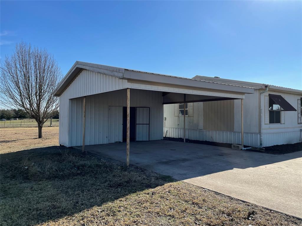 369 Private Road, Unit 4521 Wolfe City, TX 75496 - Photo 3 of 23 a house view with a backyard space
