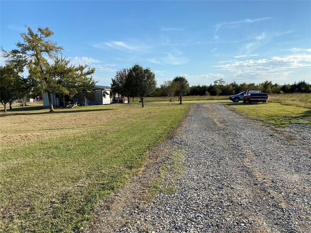 369 Private Road, Unit 4521 Wolfe City, TX 75496 - Photo 6 of 23 a view of a lake with houses