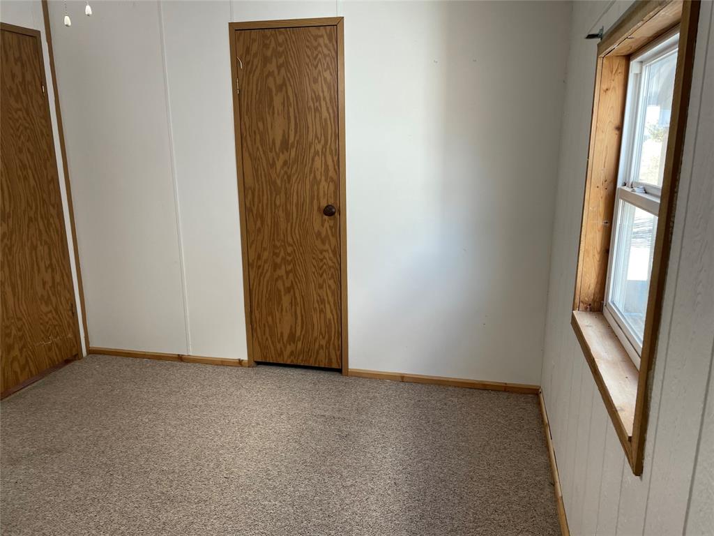 369 Private Road, Unit 4521 Wolfe City, TX 75496 - Photo 8 of 23 an empty room with windows