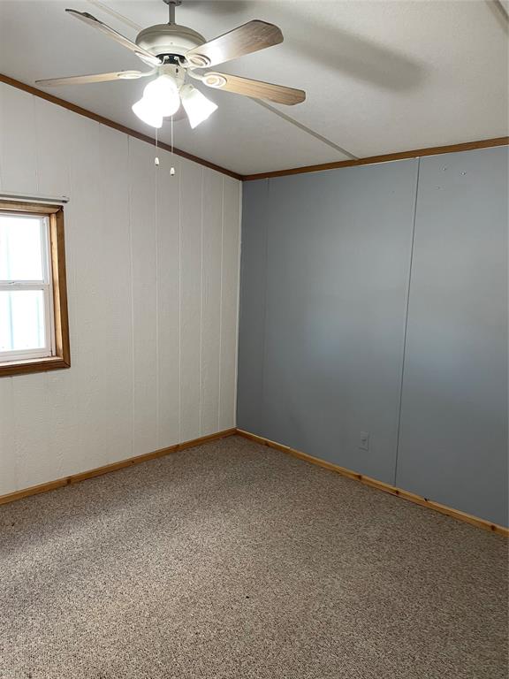 369 Private Road, Unit 4521 Wolfe City, TX 75496 - Photo 9 of 23 a view of an empty room with a fan