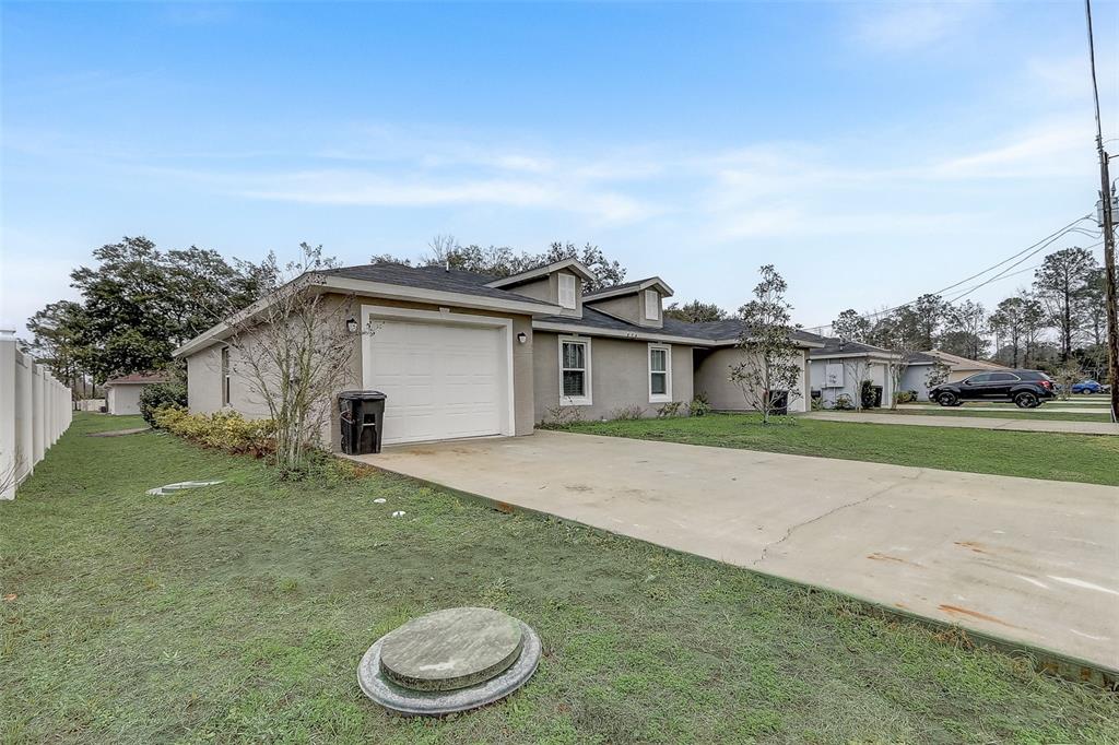 5 Rainbow Lane Palm Coast, FL 32164 - Photo 3 of 16 a view of a house with a yard