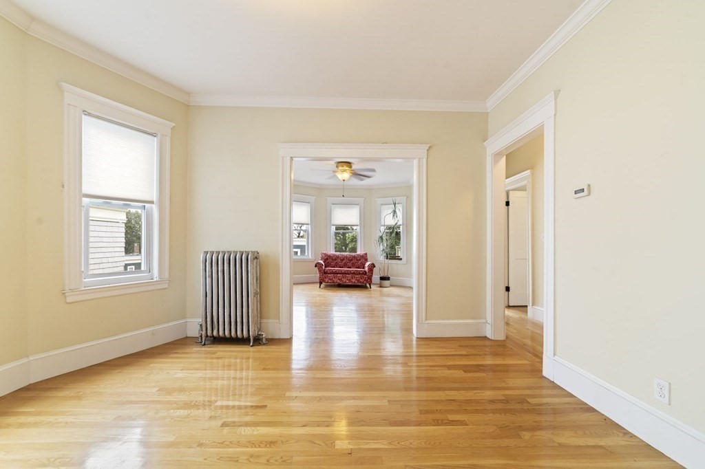 81 Montebello Road, Unit 3 Boston, MA 02130 - Photo 15 of 20 a view of a livingroom with wooden floor and a window