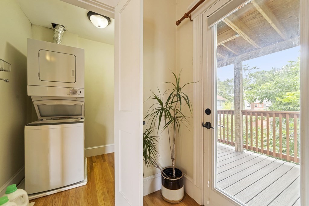 81 Montebello Road, Unit 3 Boston, MA 02130 - Photo 17 of 20 a view of a hallway with wooden floor and door
