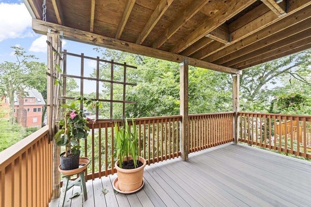 81 Montebello Road, Unit 3 Boston, MA 02130 - Photo 5 of 20 a view of a porch with furniture and wooden floor