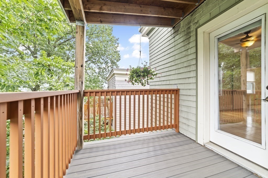 81 Montebello Road, Unit 3 Boston, MA 02130 - Photo 6 of 20 a view of a balcony with wooden floor