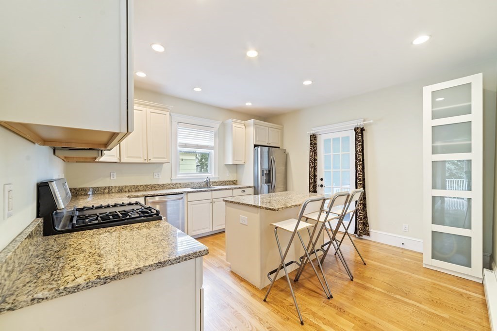 81 Montebello Road, Unit 3 Boston, MA 02130 - Photo 7 of 20 a kitchen with a table and chairs in it