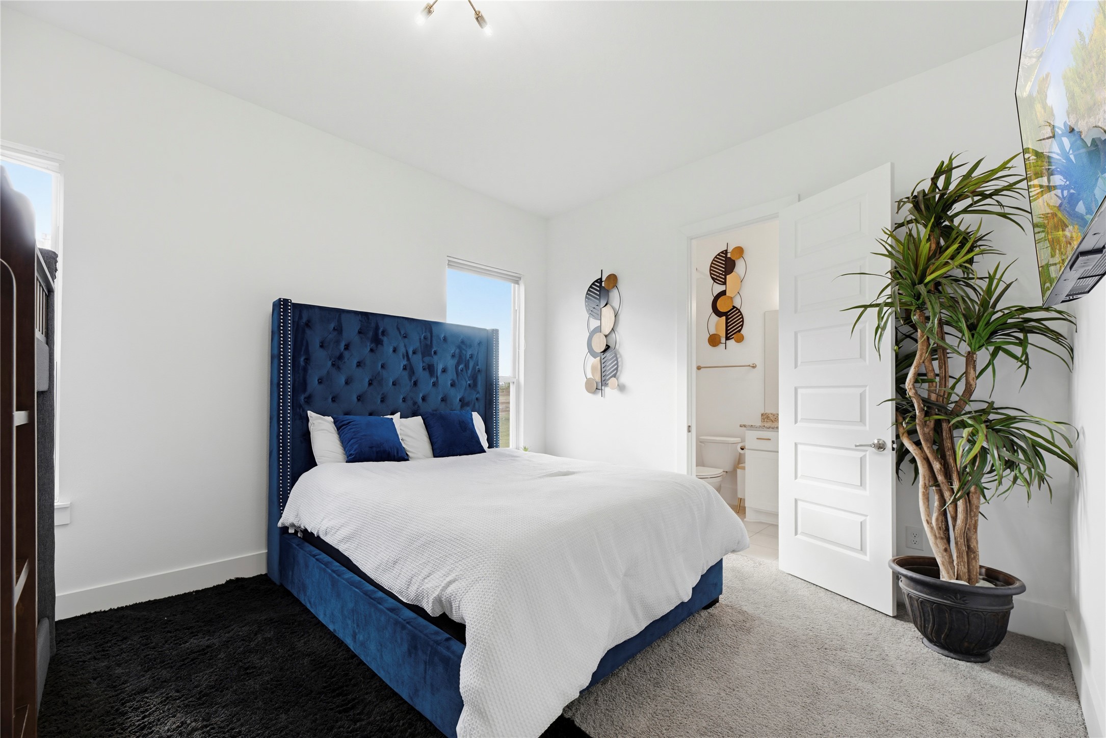 29526 Cir S Rnch Trail Fulshear, TX 77406 - Photo 26 of 47 This well-appointed first-floor bedroom showcases the clean white walls and large window creating a bright, inviting atmosphere for family members or long-term guests.