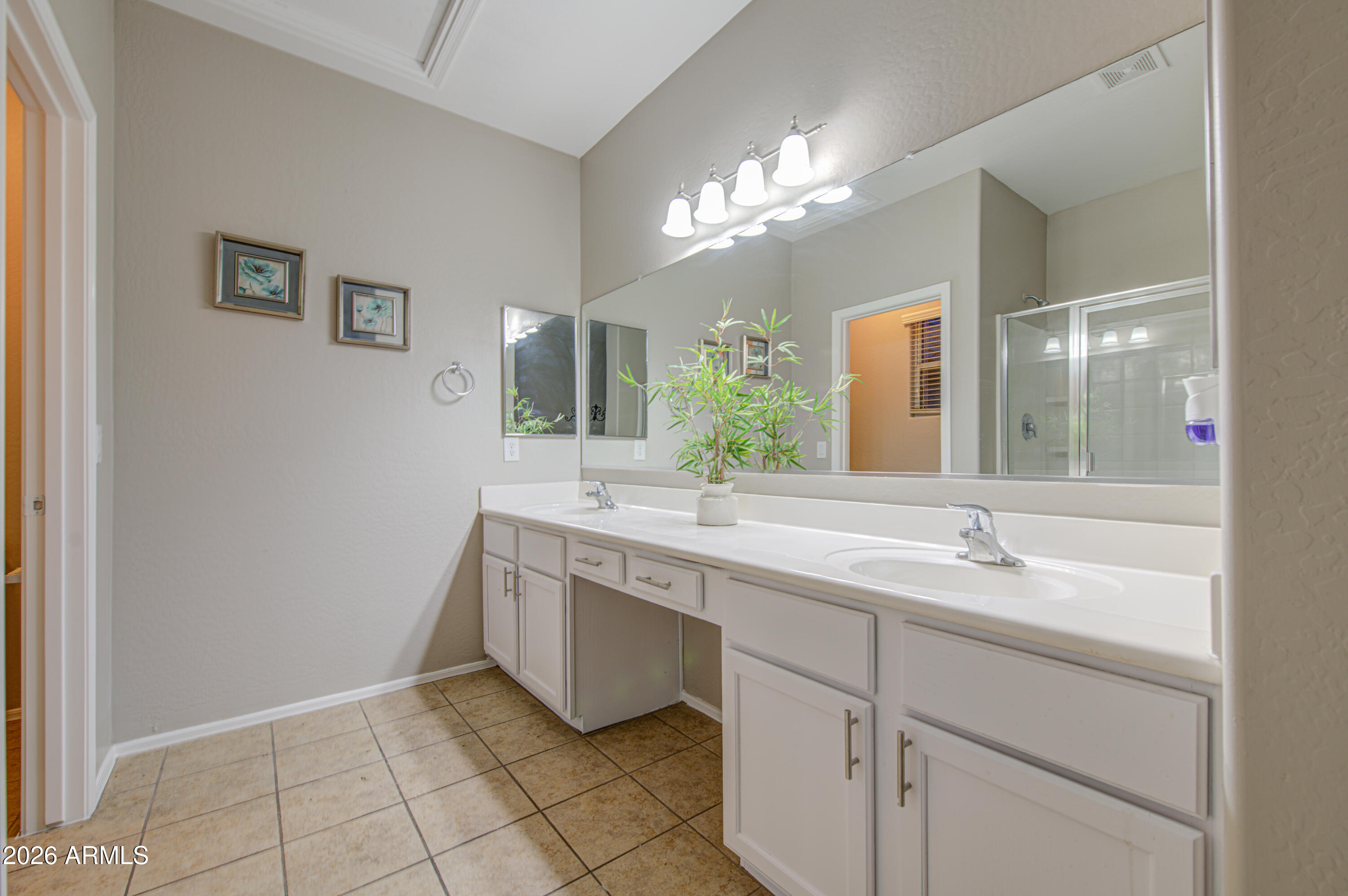 7759 West Monte Vista Road Phoenix, AZ 85035 - Photo 29 of 43 a spacious bathroom with a granite countertop sink a toilet and a mirror