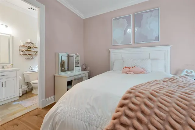 a view of a patio with couches table and chairs and potted plants