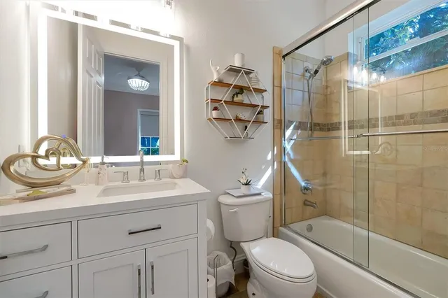 a view of a lake with a house in the background