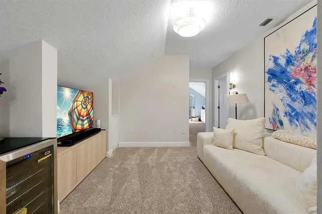 a view of a patio with a table and chairs under an umbrella