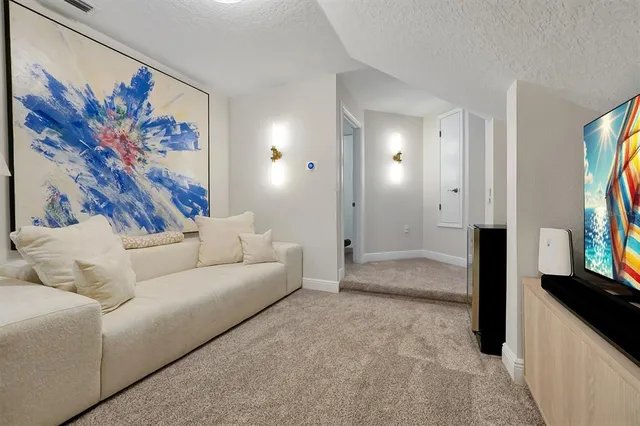 a view of a house with swimming pool and sitting area