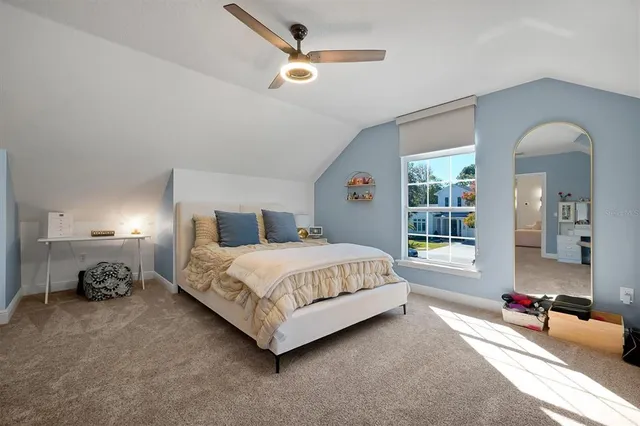 an aerial view of a house with a yard basket ball court and outdoor seating