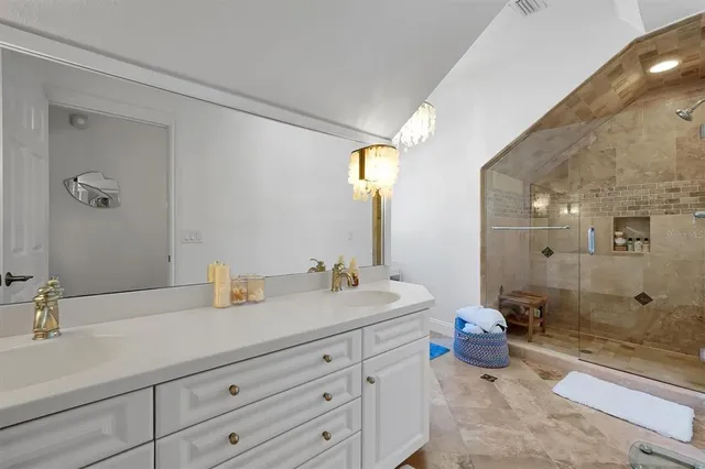 an aerial view of lake and residential houses with outdoor space