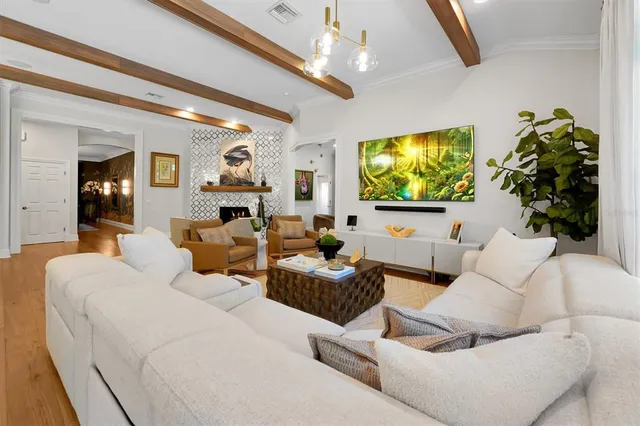 a living room with furniture and a mirror