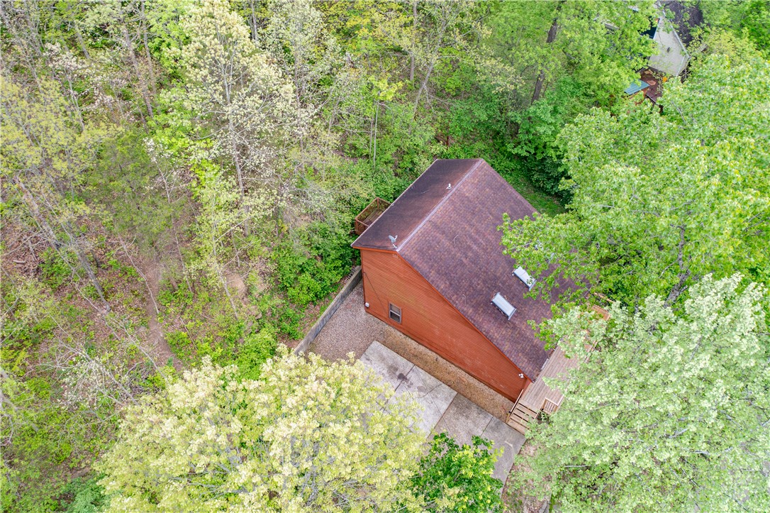 10584 New Biddinger Road Harrison, OH 45030 - Photo 3 of 61 Perched among lush greenery, this home offers tranquil tree-lined views.