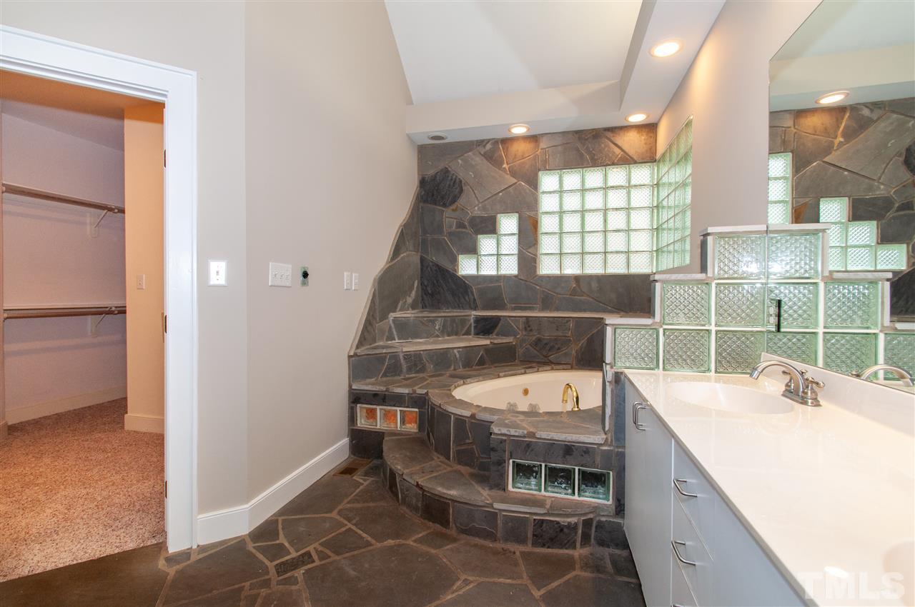 1700 Percheron Place Raleigh, NC 27613 - Photo 18 of 30 a bathroom with a double vanity sink and a mirror