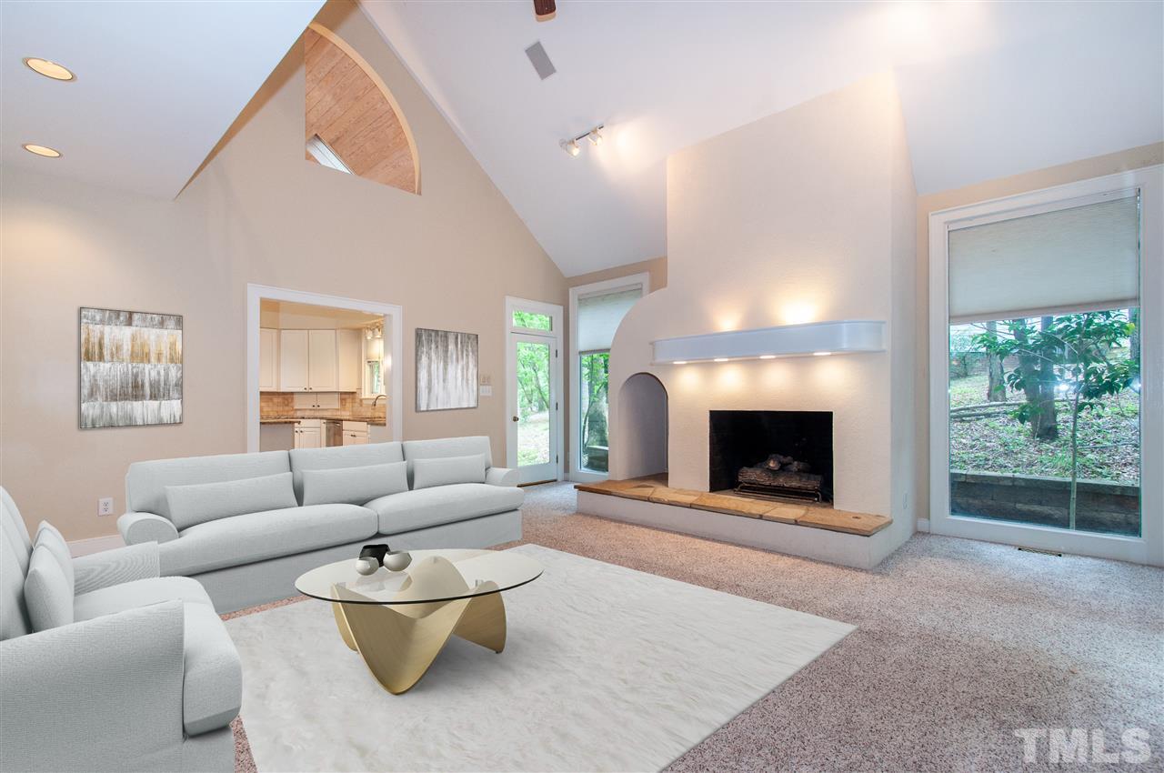 1700 Percheron Place Raleigh, NC 27613 - Photo 3 of 30 a living room with furniture a window and a fireplace