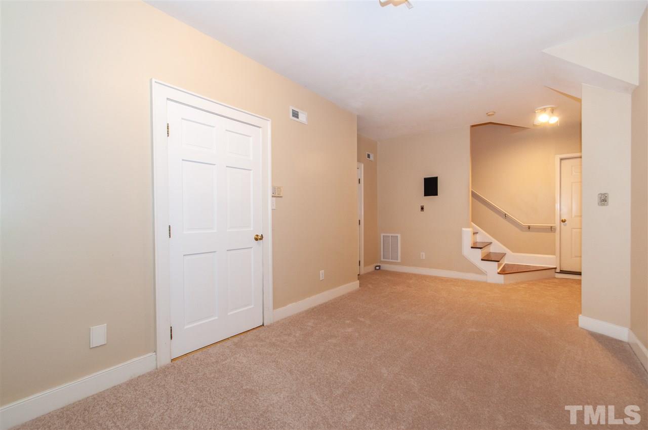 1700 Percheron Place Raleigh, NC 27613 - Photo 24 of 30 an empty room with a mirror