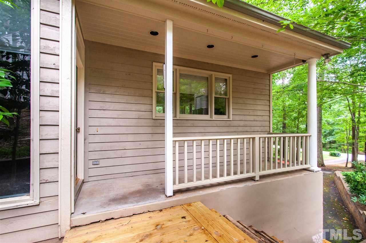 1700 Percheron Place Raleigh, NC 27613 - Photo 27 of 30 a view of a porch with a table and chair