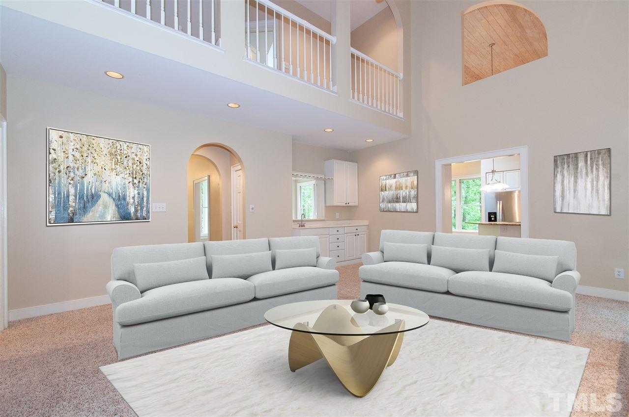 1700 Percheron Place Raleigh, NC 27613 - Photo 5 of 30 a living room with furniture and a large window