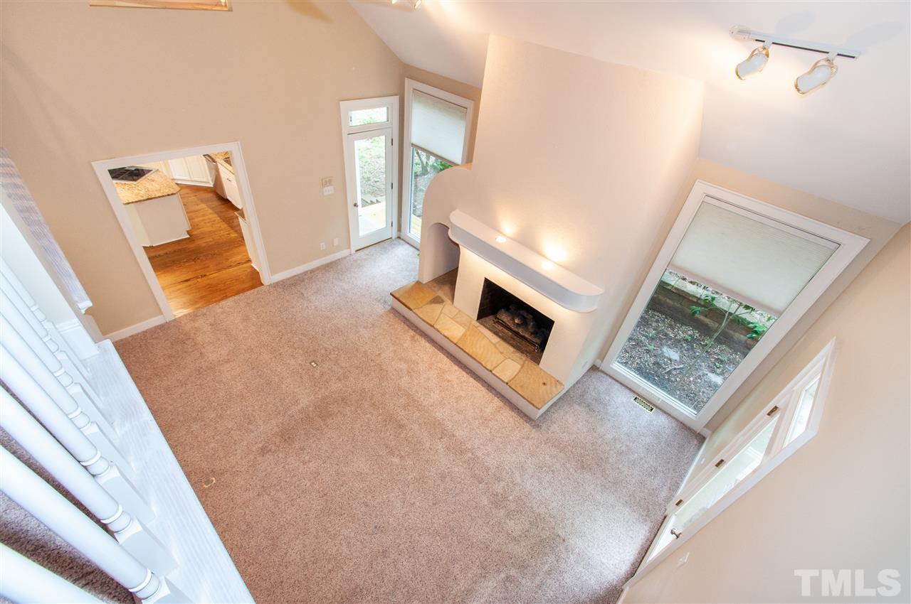 1700 Percheron Place Raleigh, NC 27613 - Photo 6 of 30 a living room with furniture and a rug