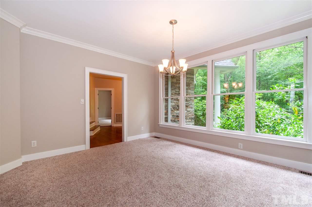 1700 Percheron Place Raleigh, NC 27613 - Photo 8 of 30 a view of an empty room with windows and refrigerator