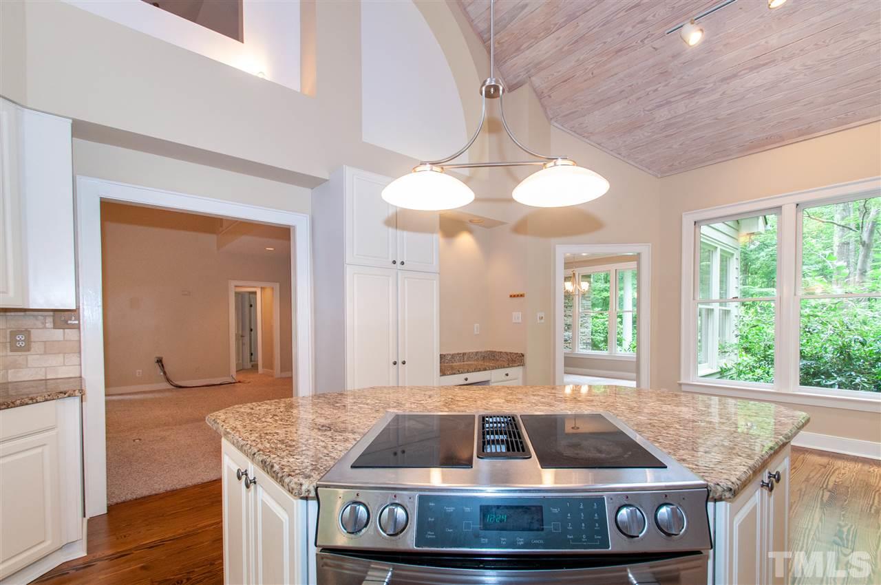 1700 Percheron Place Raleigh, NC 27613 - Photo 10 of 30 a room that has a table and chairs in it