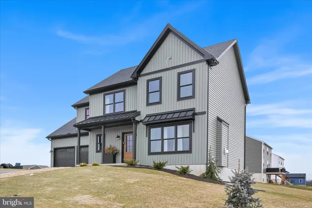 a view of a white house with a large windows