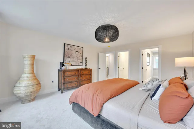 a bedroom with a bed and dresser