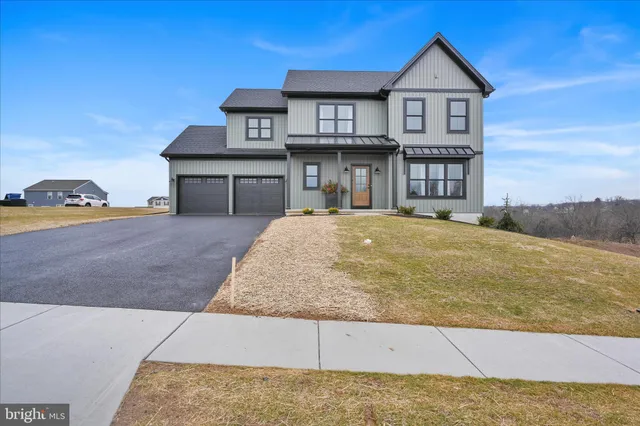 a front view of a house with garage