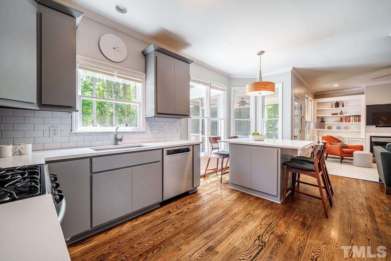 325 Morris Road Pittsboro, NC 27312 - Photo 11 of 39 a kitchen with sink cabinets and wooden floor