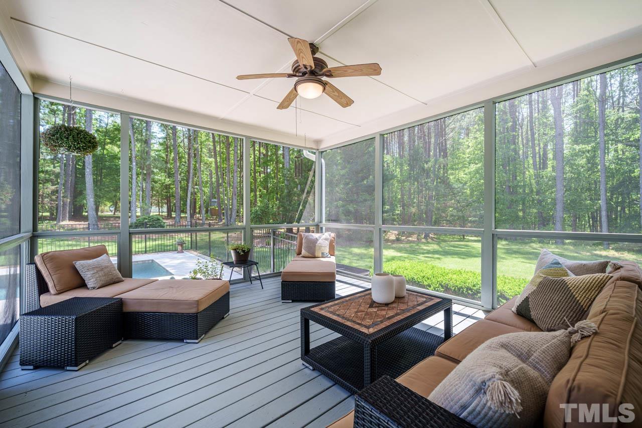 325 Morris Road Pittsboro, NC 27312 - Photo 14 of 39 a living room with furniture and a floor to ceiling window