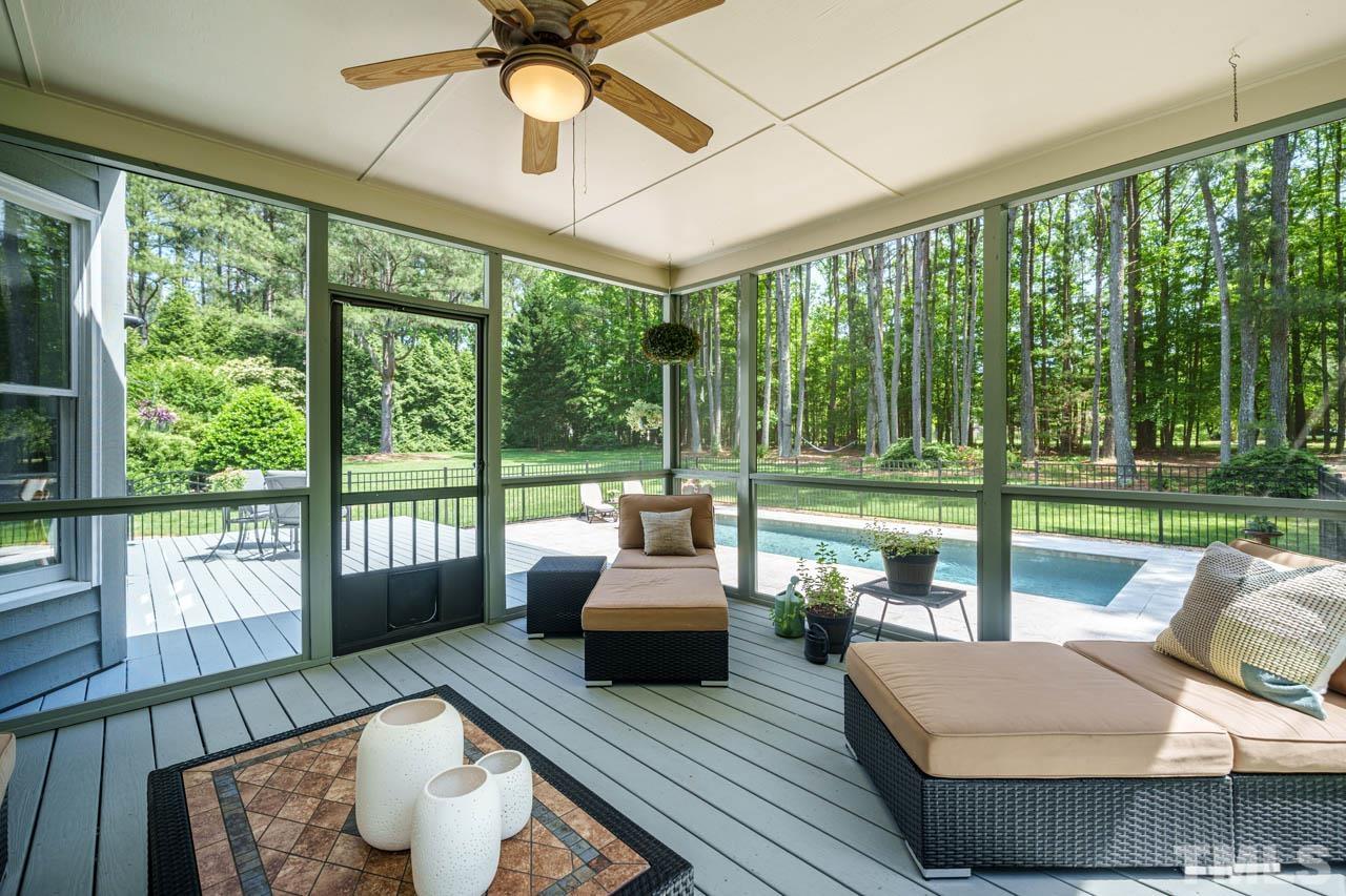 325 Morris Road Pittsboro, NC 27312 - Photo 15 of 39 a living room with couch and a floor to ceiling window