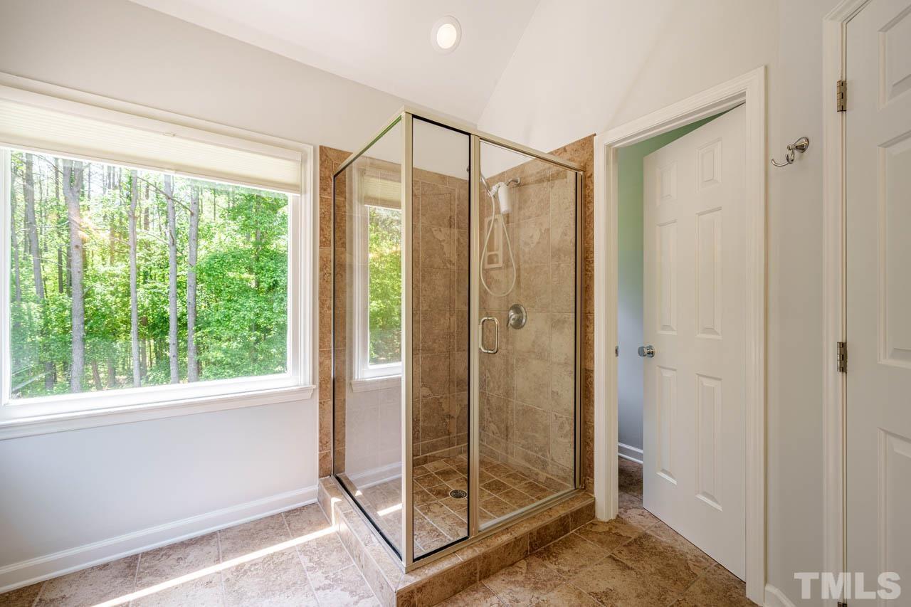 325 Morris Road Pittsboro, NC 27312 - Photo 20 of 39 a bathroom with a glass shower door