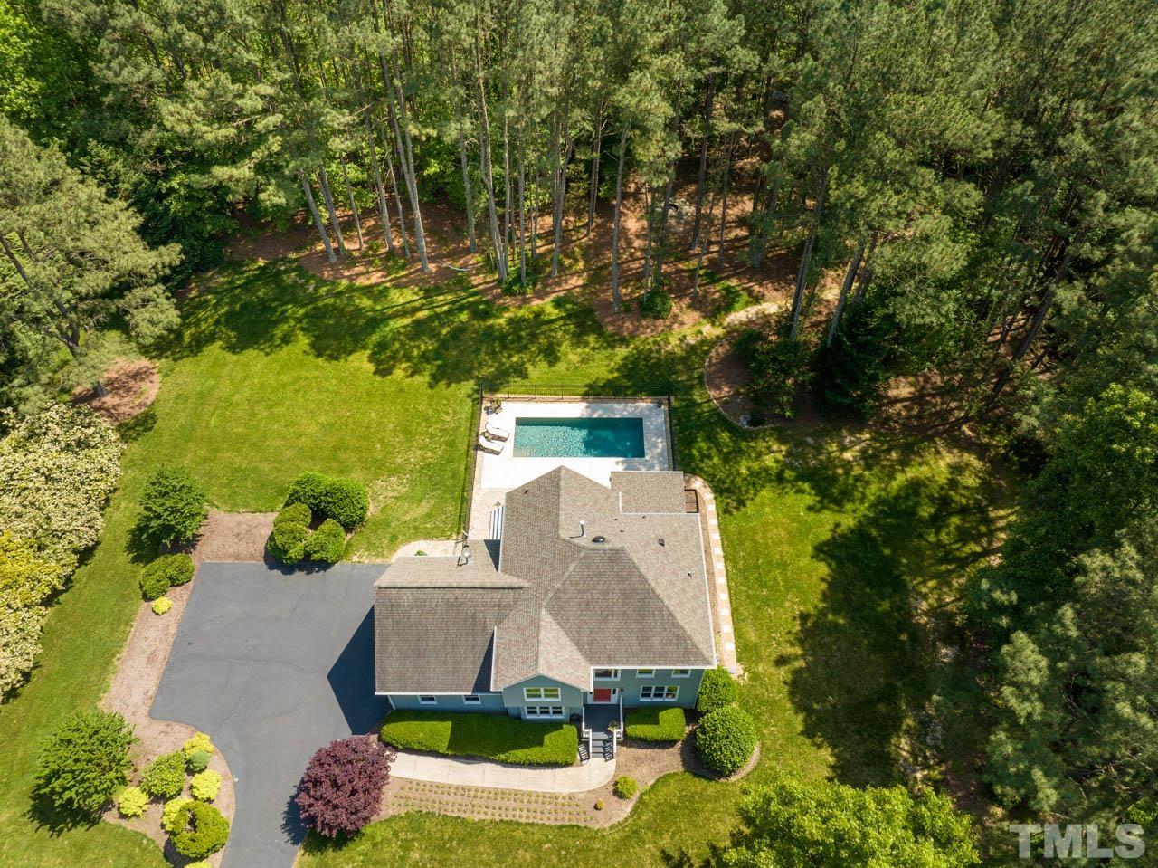 325 Morris Road Pittsboro, NC 27312 - Photo 2 of 39 an aerial view of a house with yard swimming pool and outdoor seating