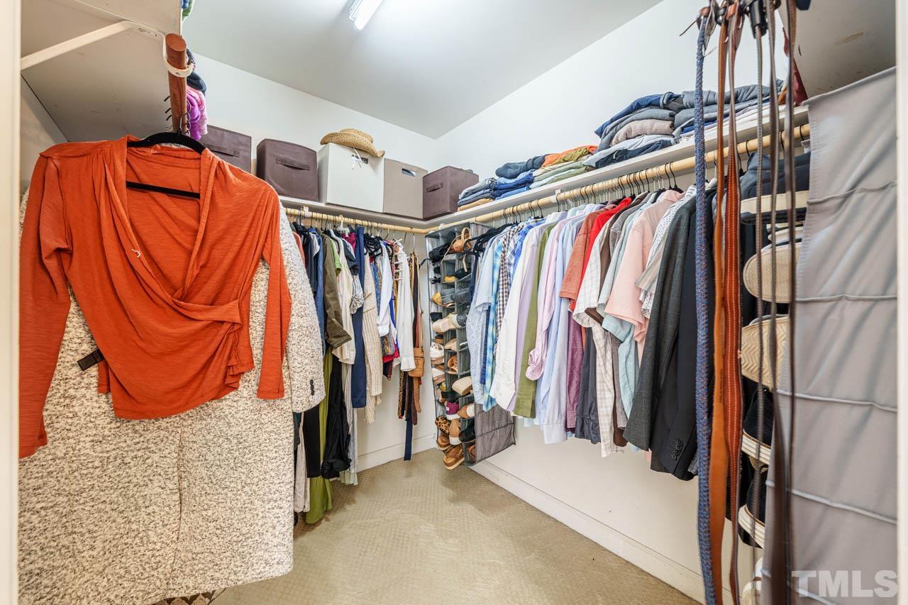 325 Morris Road Pittsboro, NC 27312 - Photo 21 of 39 a view of walk in closet with clothes and shoes