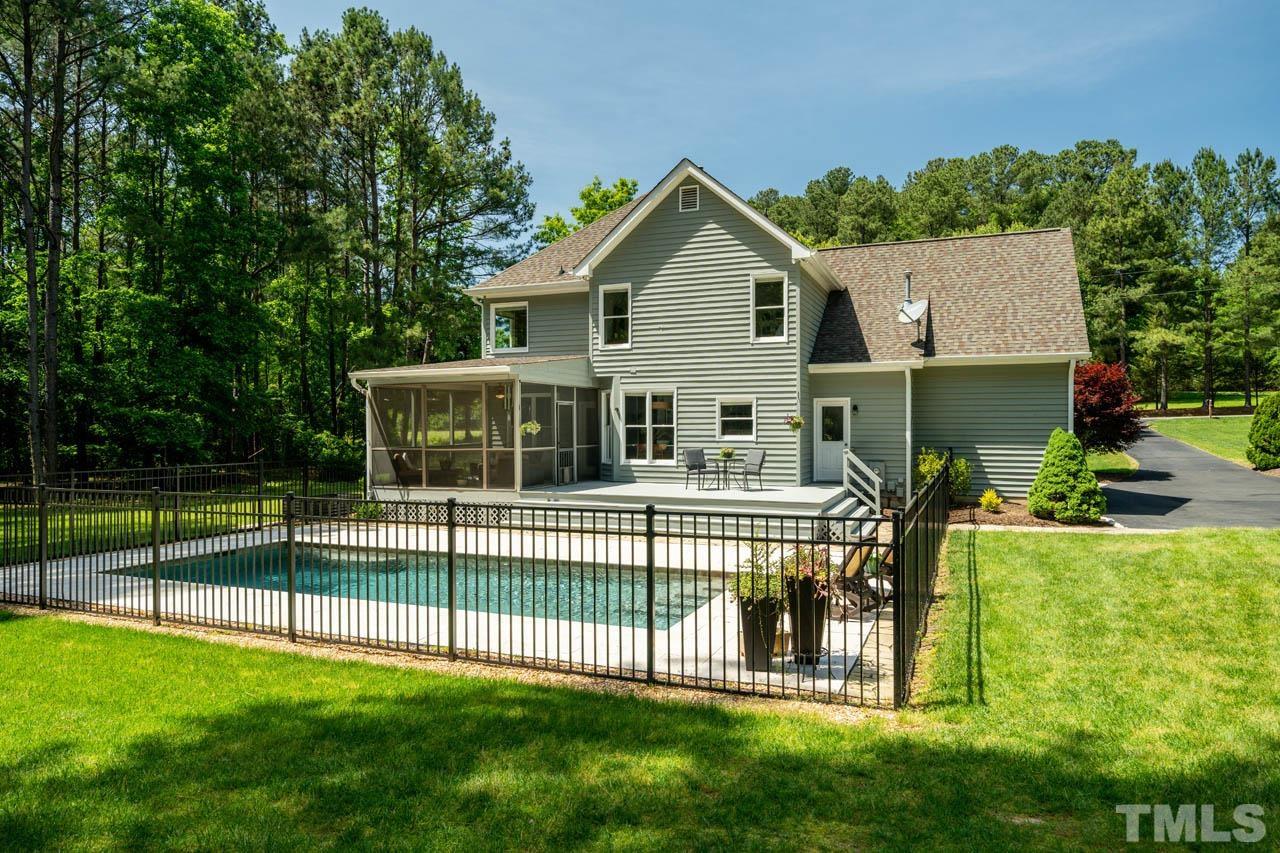325 Morris Road Pittsboro, NC 27312 - Photo 36 of 39 a view of a house with a backyard and a garden