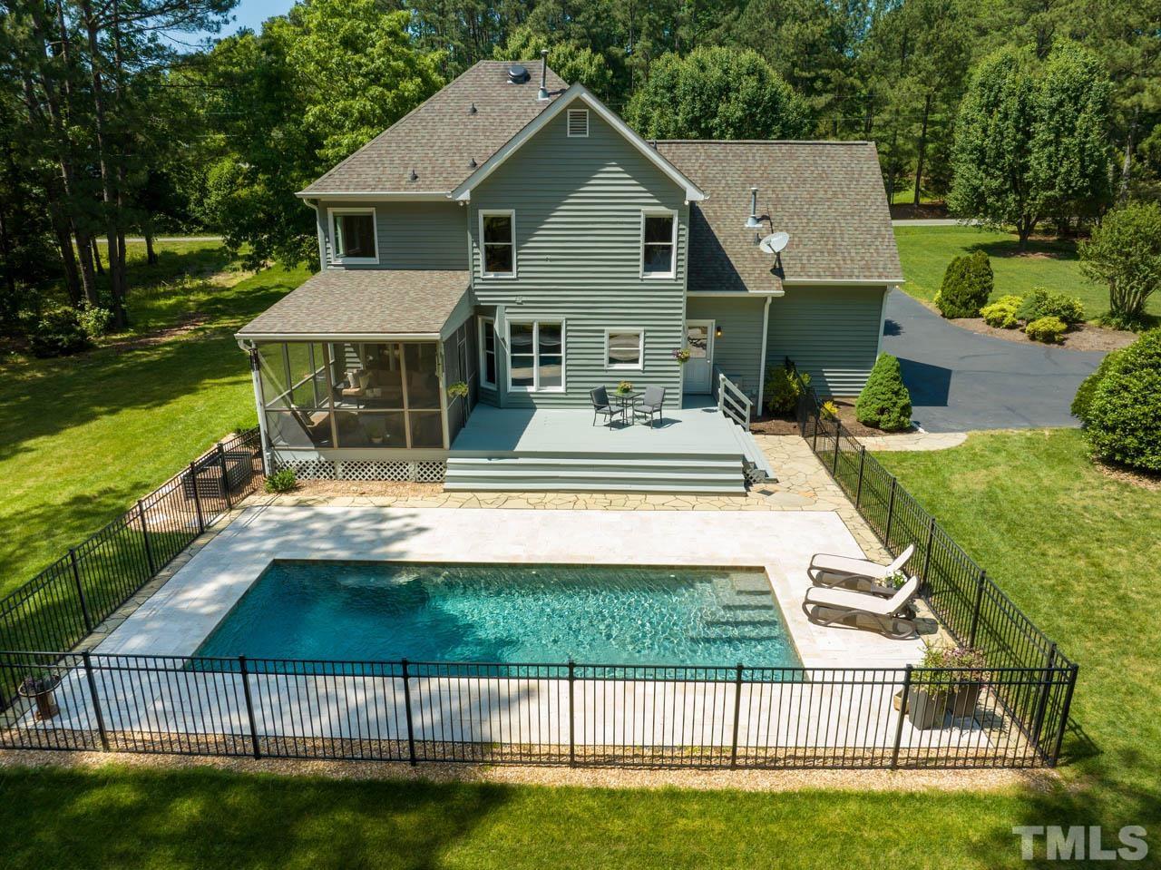 325 Morris Road Pittsboro, NC 27312 - Photo 37 of 39 a view of house with yard outdoor seating and lake