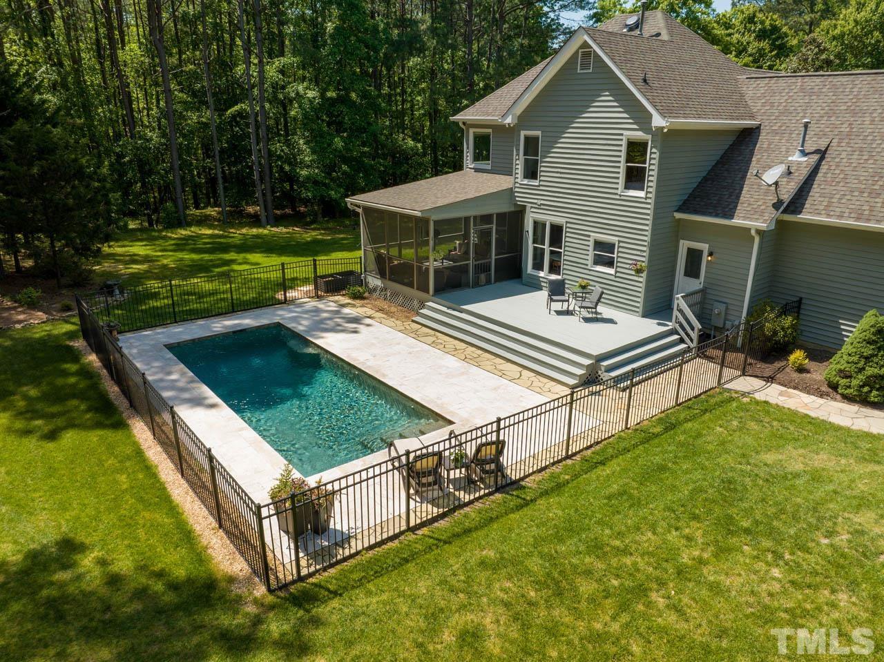 325 Morris Road Pittsboro, NC 27312 - Photo 38 of 39 a view of a house with pool and a yard