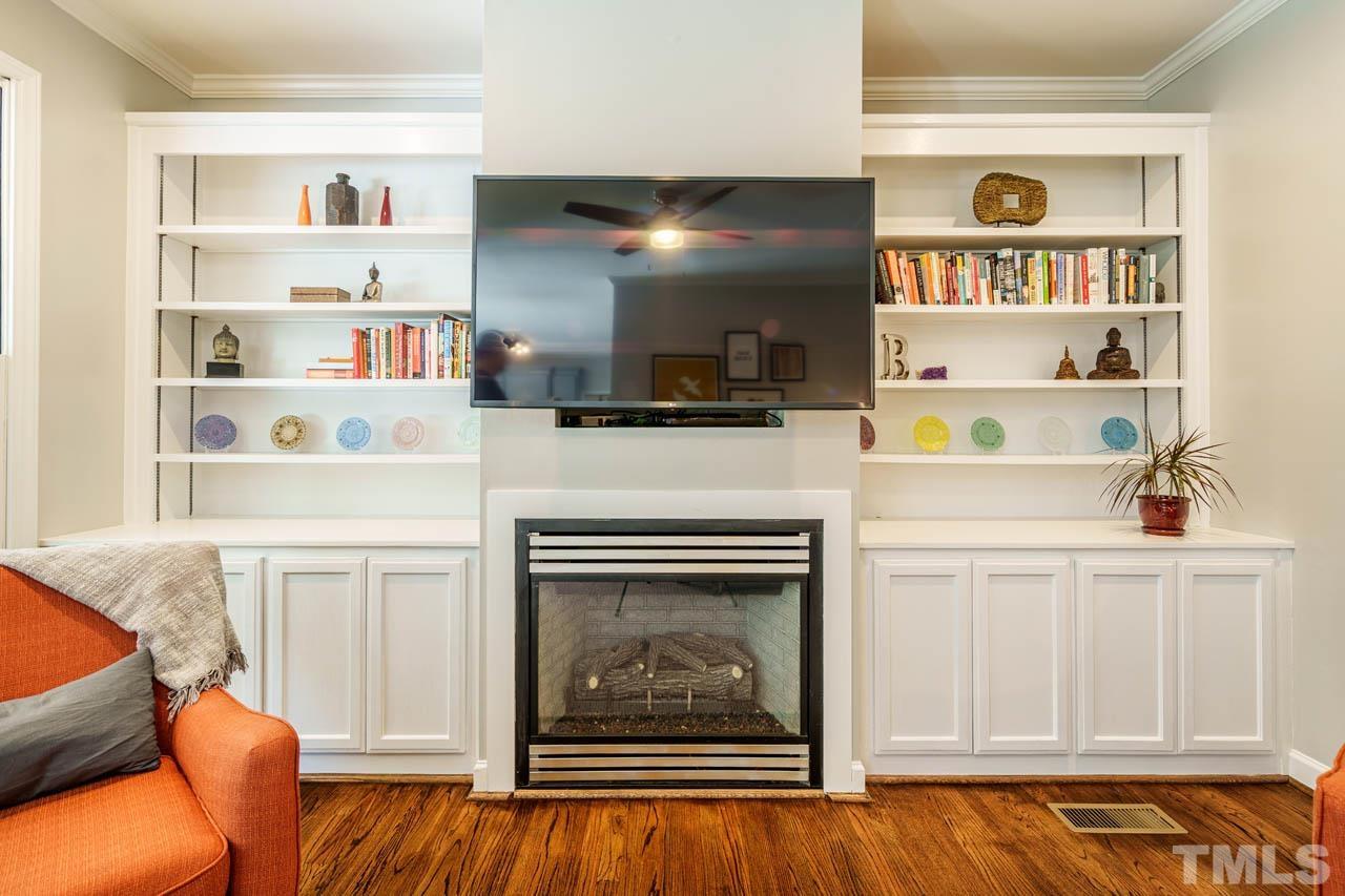 325 Morris Road Pittsboro, NC 27312 - Photo 8 of 39 a kitchen with white cabinets and a fireplace