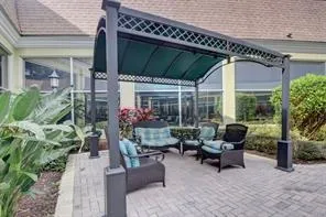 a outdoor living space with patio furniture and potted plants