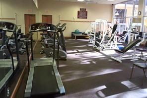 766 Normandy P, Unit 766 Delray Beach, FL 33484 - Photo 26 of 29 a view of a room with gym equipment