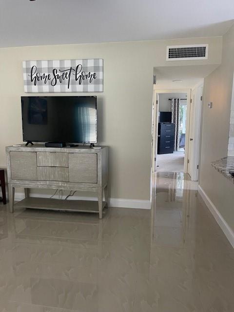 766 Normandy P, Unit 766 Delray Beach, FL 33484 - Photo 5 of 29 a view of living room with furniture and flat screen tv