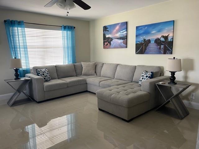 766 Normandy P, Unit 766 Delray Beach, FL 33484 - Photo 7 of 29 a living room with furniture and a window