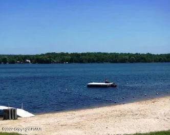 a view of a field with an ocean