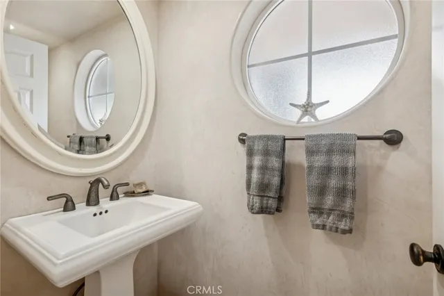 a kitchen with stainless steel appliances granite countertop a sink a stove and a wooden floors